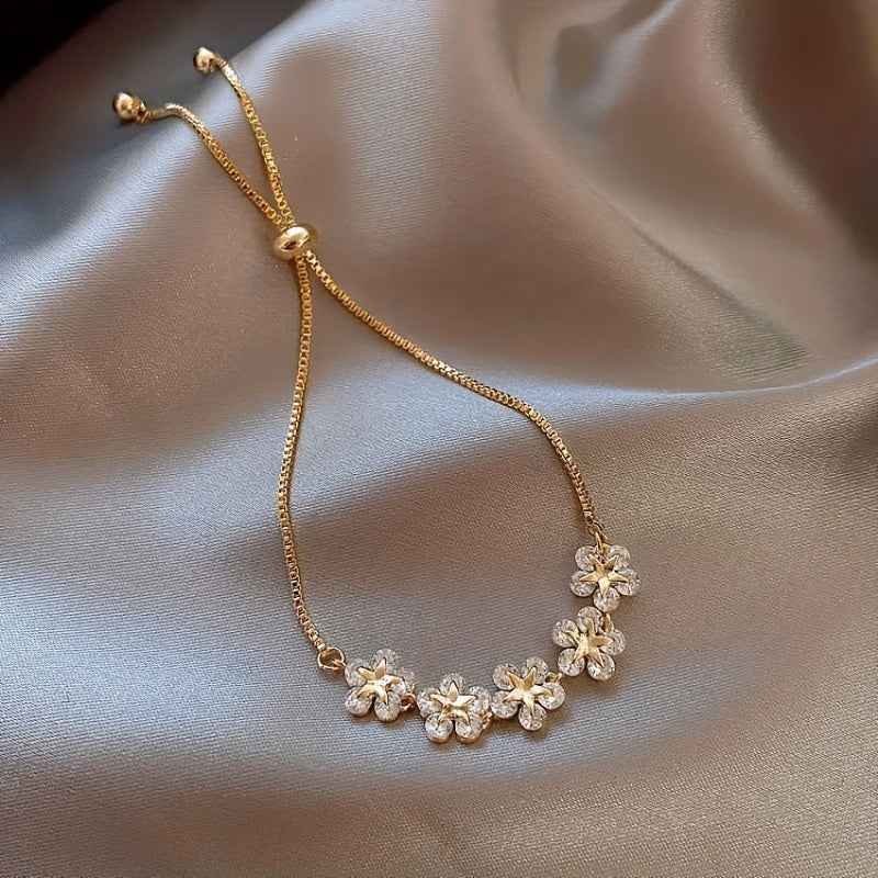 PULSEIRA FLORES BANHADA EM OURO 18K - PLSI 9421