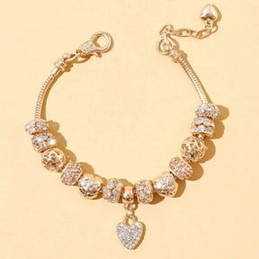 PULSEIRA PANDORA COM BERLOQUES CRAVEJADOS BANHADA EM OURO 18K - PL4314