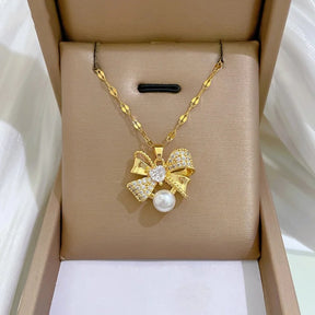 CONJUNTO LAÇOS E PÉROLAS BANHADO EM OURO 18K - CONJ242