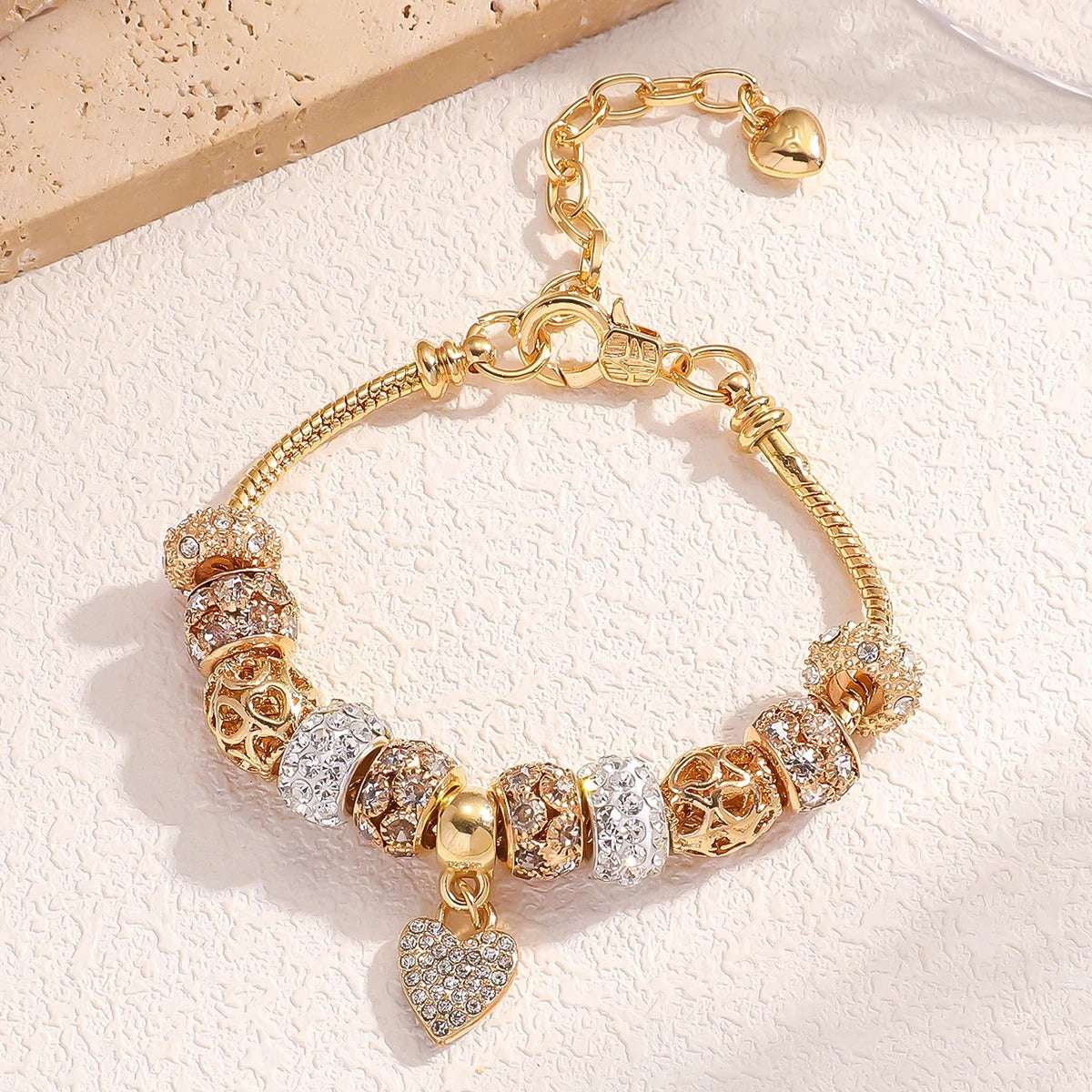 PULSEIRA PANDORA COM BERLOQUES CRAVEJADOS BANHADA EM OURO 18K - PL4314