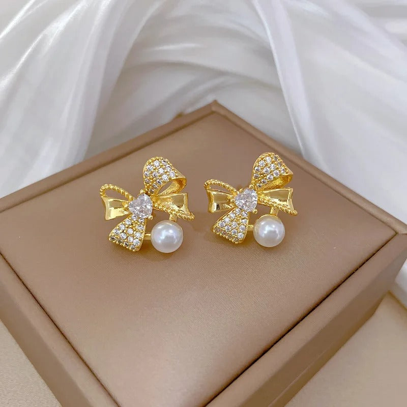 CONJUNTO LAÇOS E PÉROLAS BANHADO EM OURO 18K - CONJ242