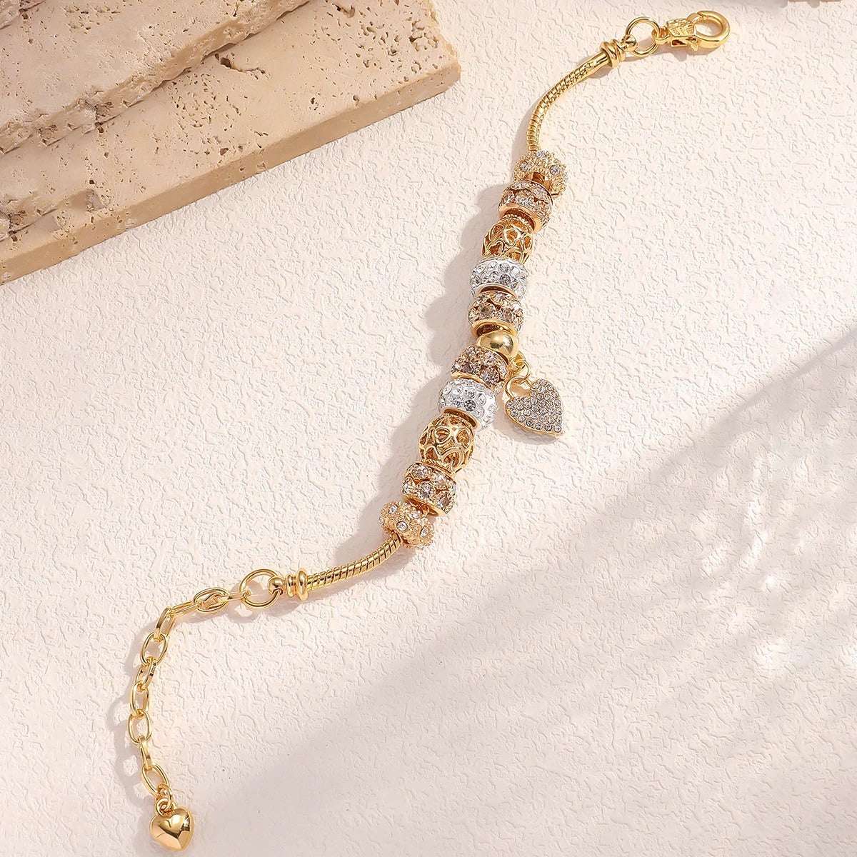 PULSEIRA PANDORA COM BERLOQUES CRAVEJADOS BANHADA EM OURO 18K - PL4314
