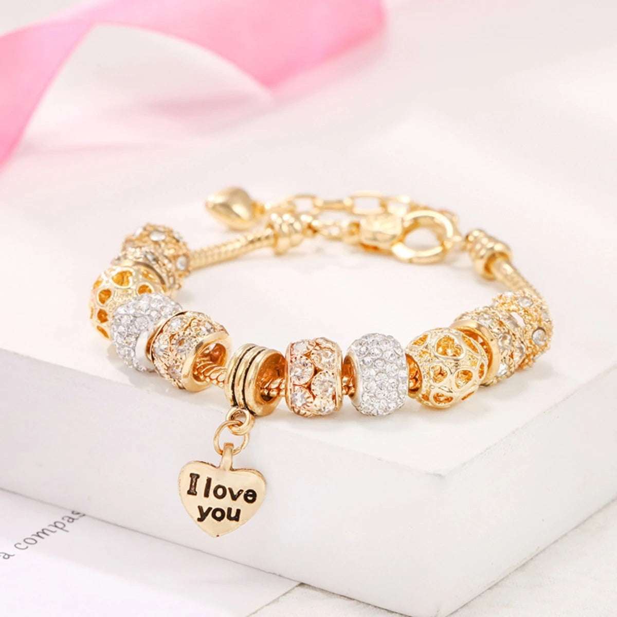 PULSEIRA PANDORA COM BERLOQUES CRAVEJADOS BANHADA EM OURO 18K - PL334